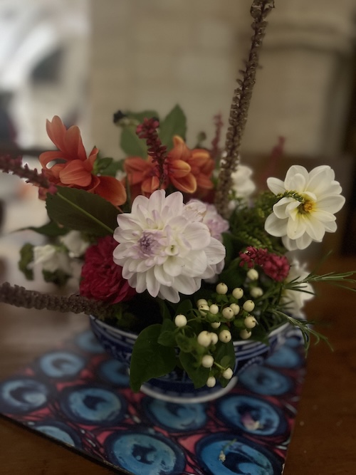 A close-up of a flower arrangement

AI-generated content may be incorrect.